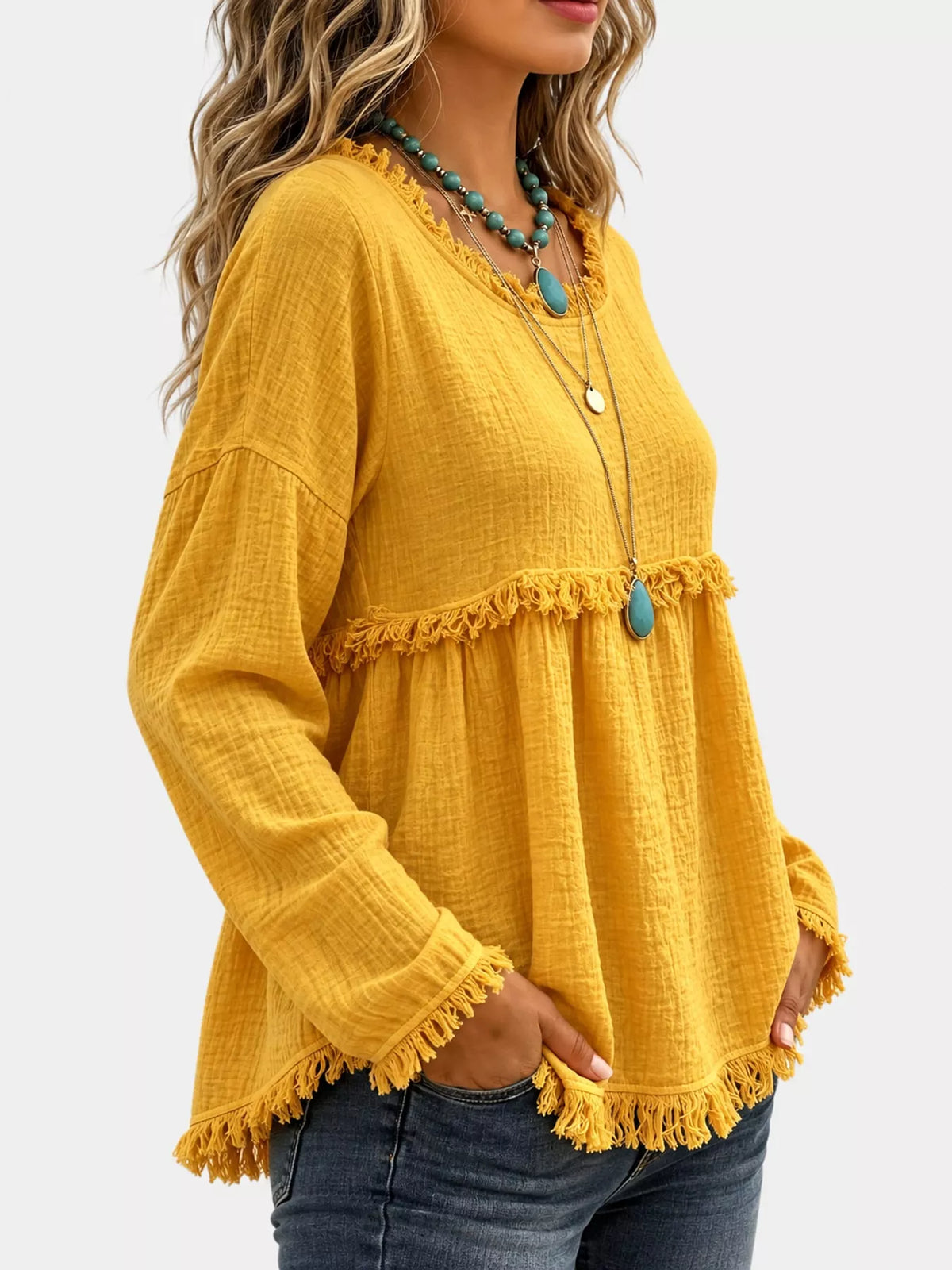Yellow frayed hem textured blouse, side view
