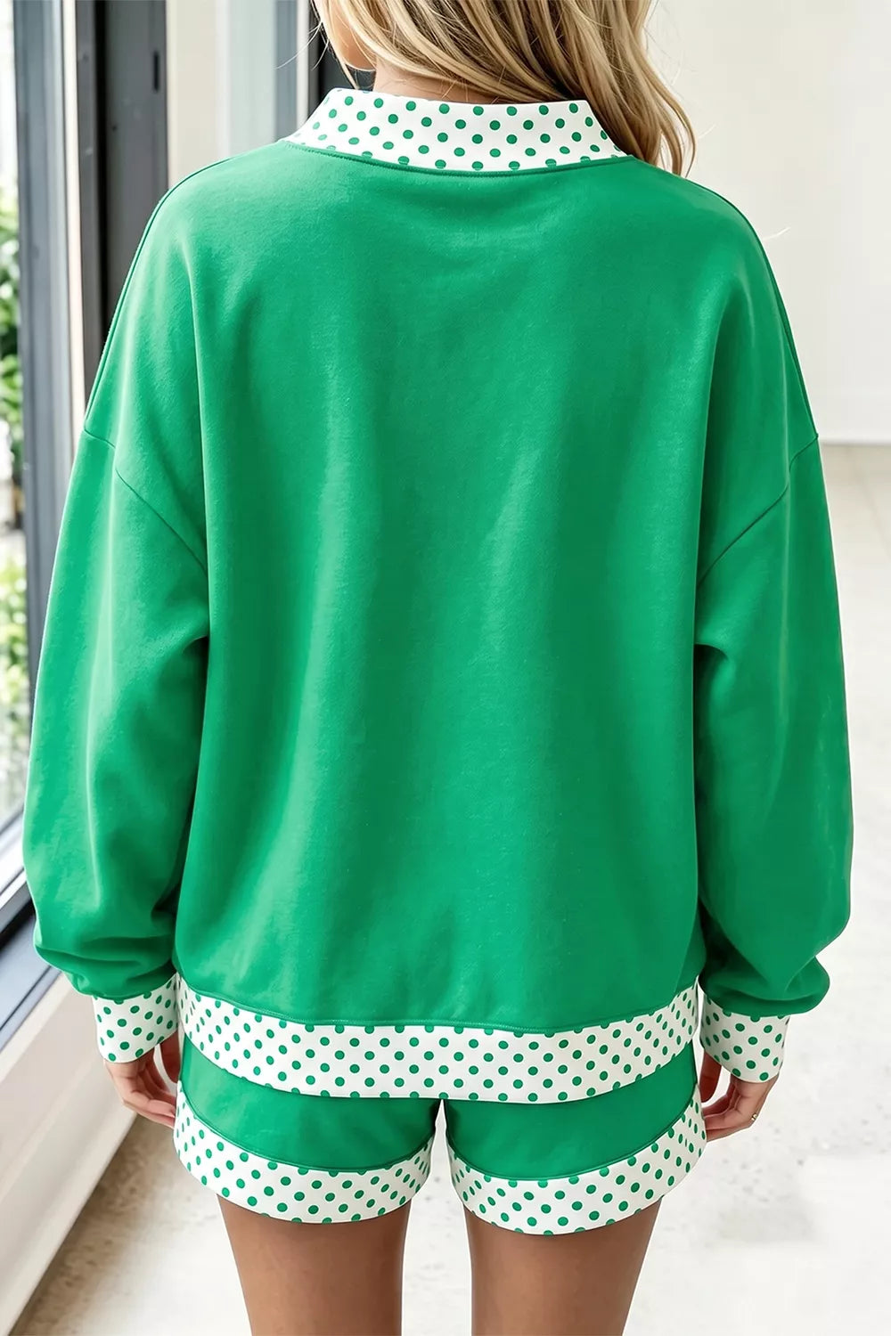 Green sweatshirt and shorts set with polka-dot trim, back view