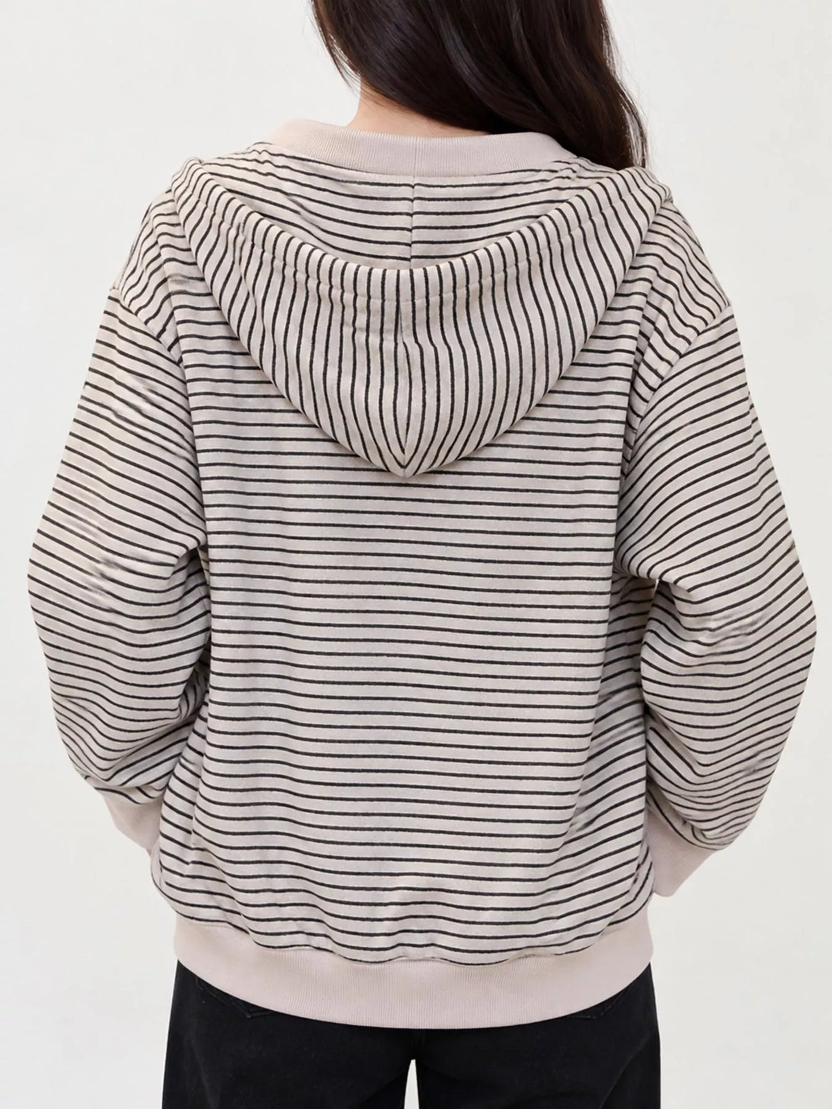 Cream and gray striped zip-up hoodie, back view