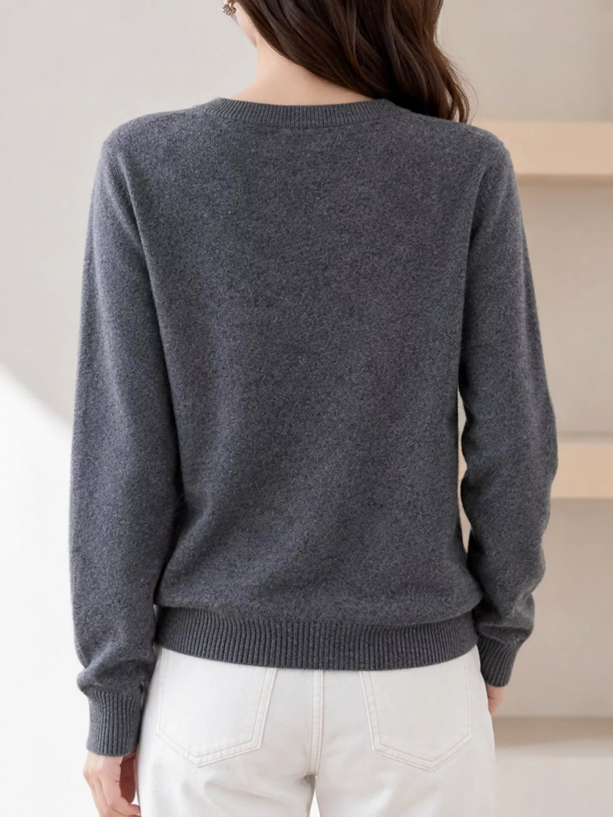 Dark gray crew neck button-front cardigan, back view