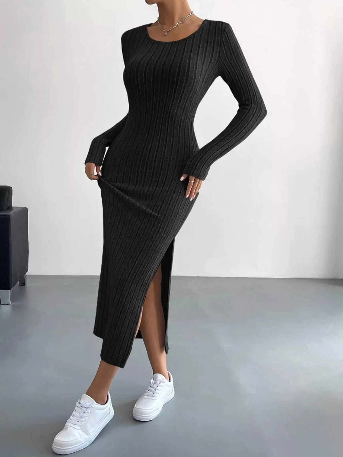 Black ribbed long sleeve knit dress with side slit