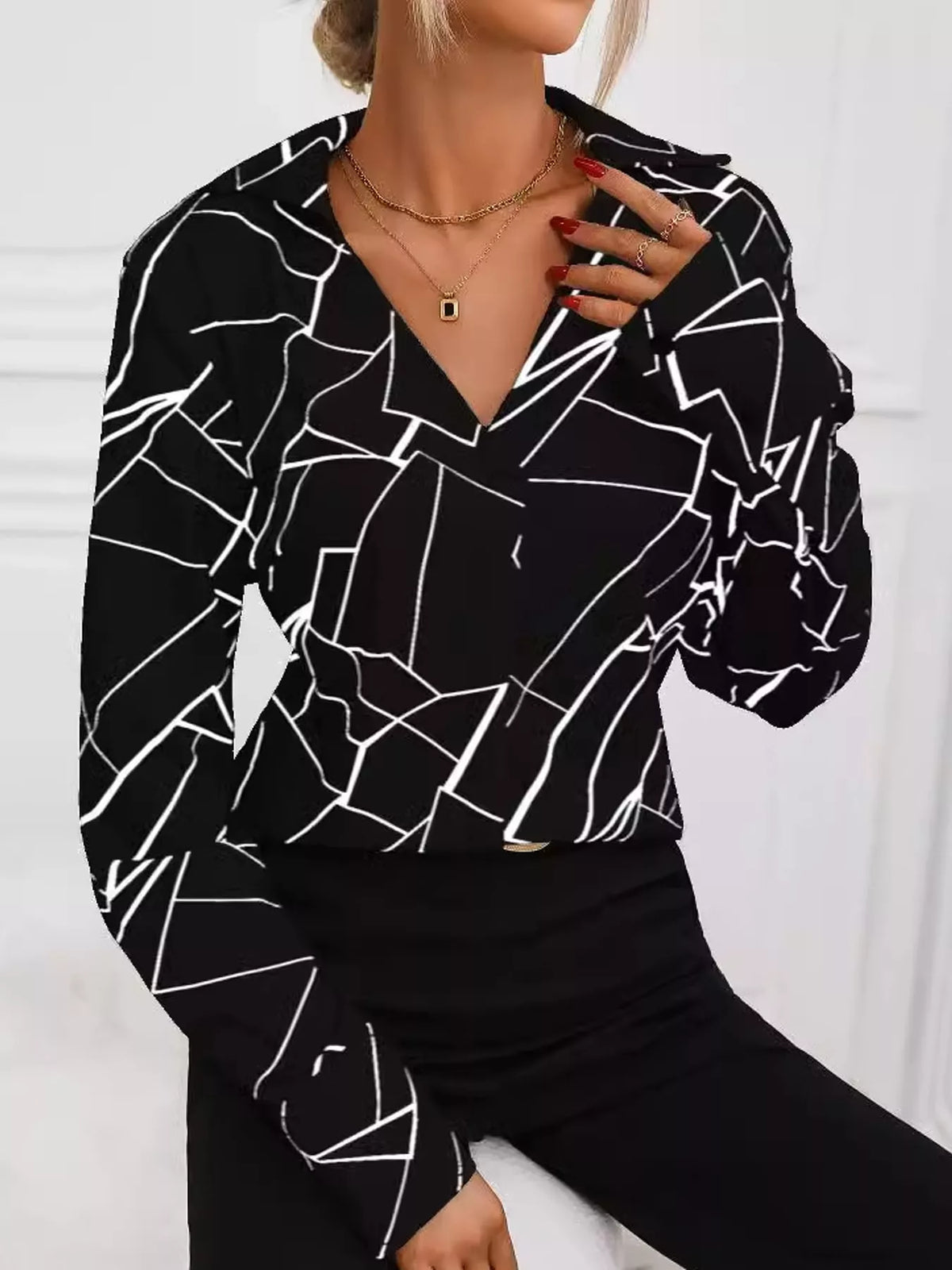 Black geometric print long sleeve blouse