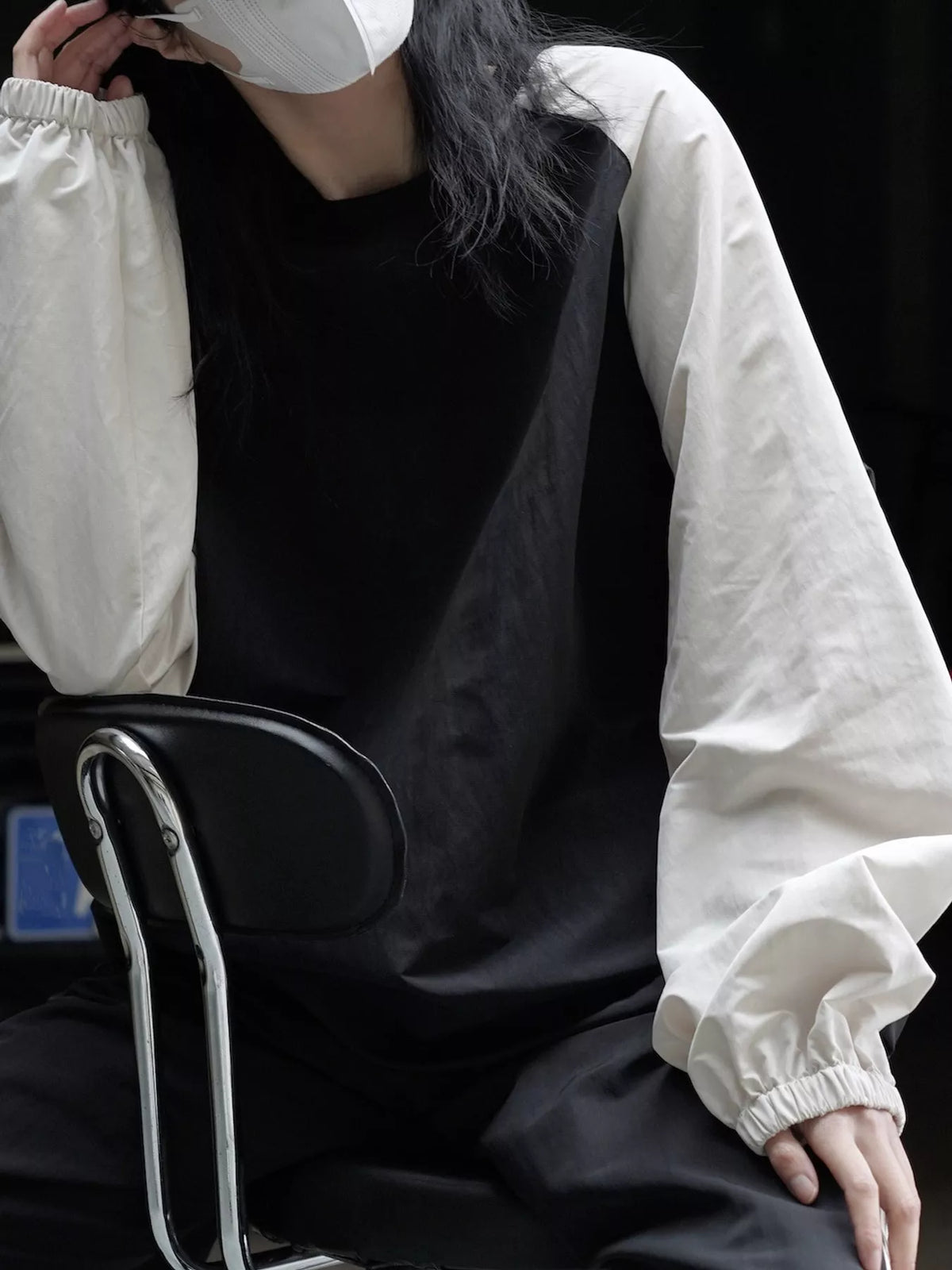 Colorblock sweatshirt, black and cream seated view
