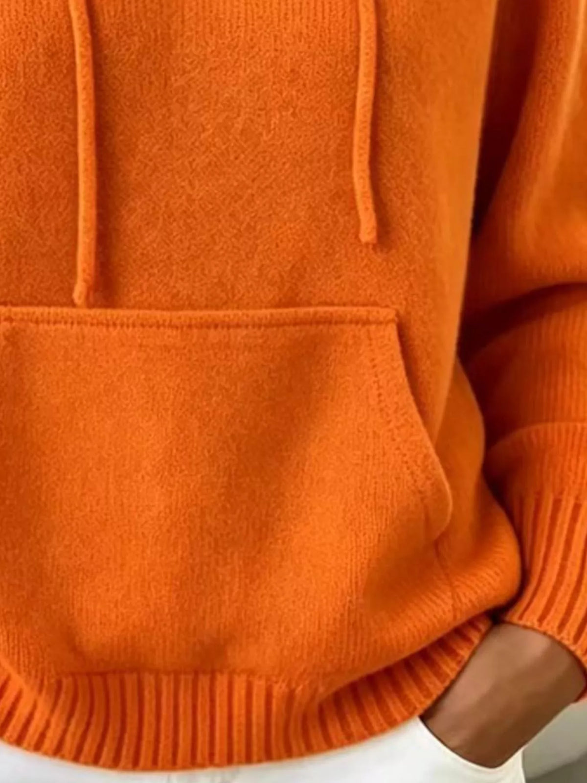 Women's Drawstring Kangaroo Pocket Hooded Sweater in orange — pocket detail view