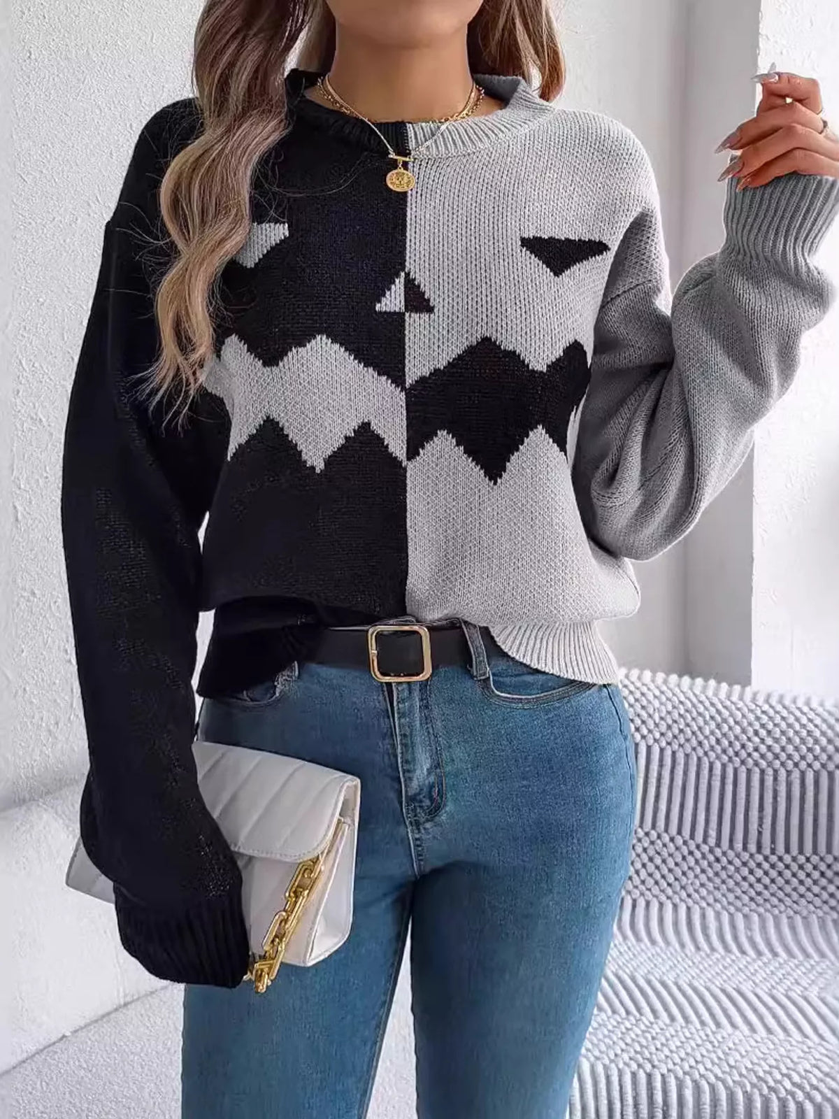 Pumpkin Face Graphic Two Tone Sweater in gray and black, front view