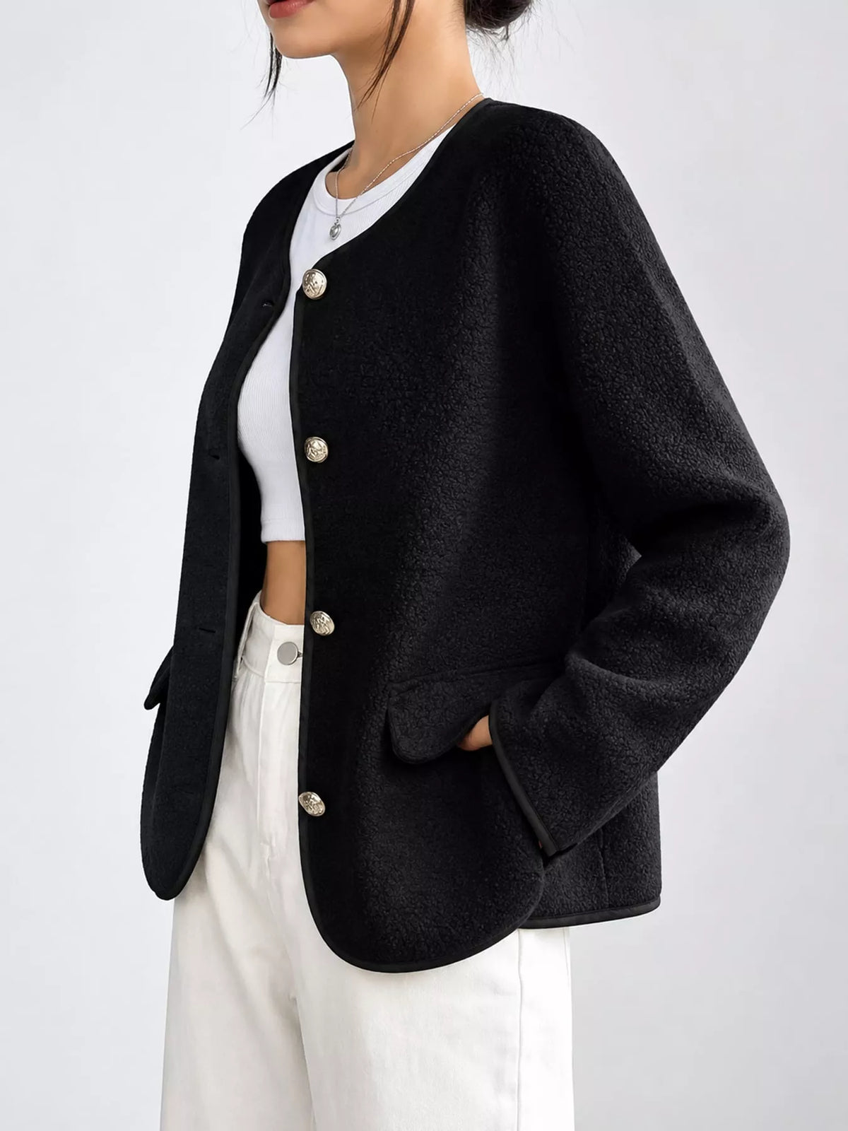 Black textured button-front jacket — side view