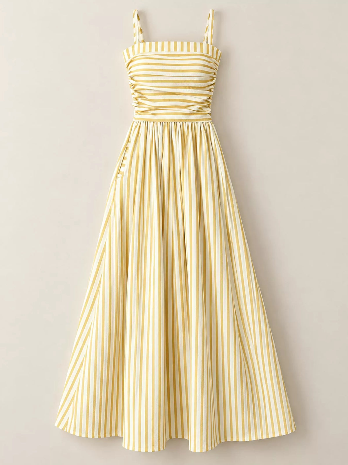 Yellow and white striped spaghetti strap maxi dress with gathered bodice and pockets