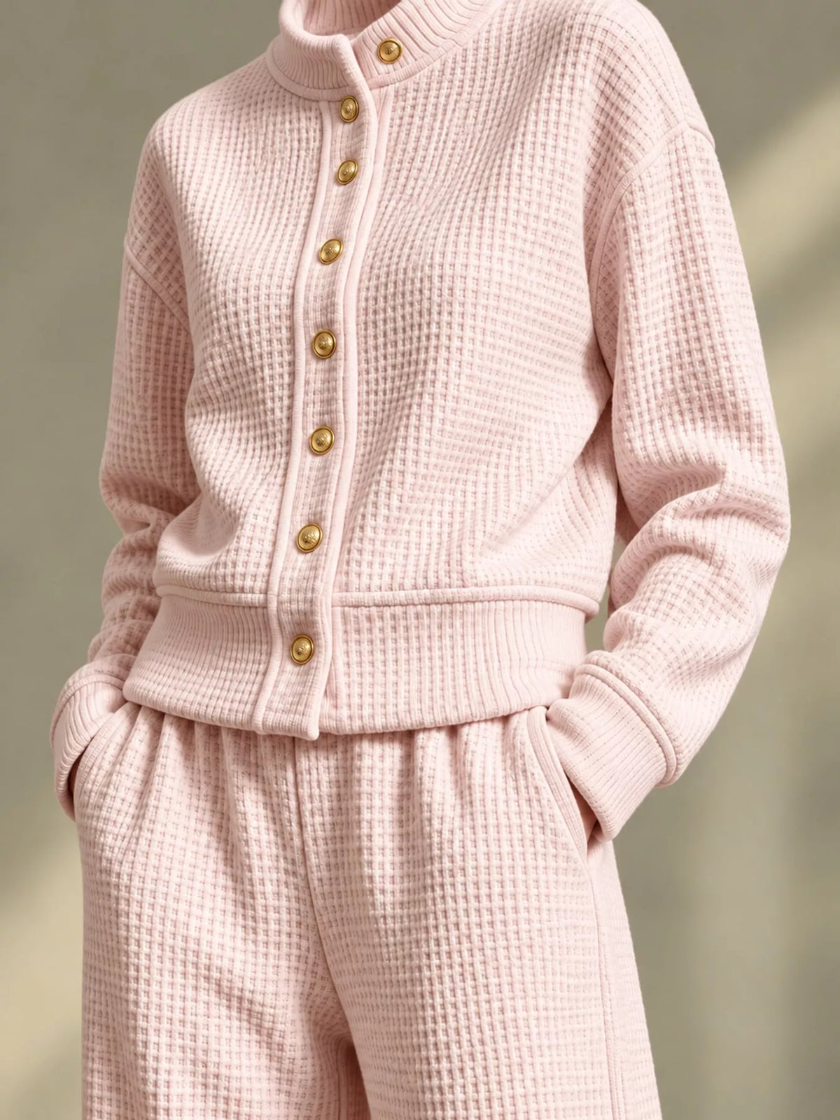 Pink waffle knit button-up outerwear and wide-leg pants set