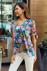 Trendsi Petal Dew Full Size Floral V-Neck Tie Detail Blouse - Shirts