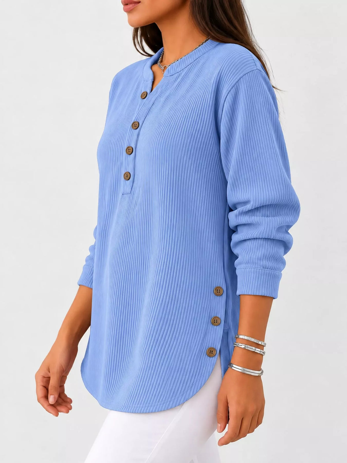 Light blue button detail long sleeve top, side view