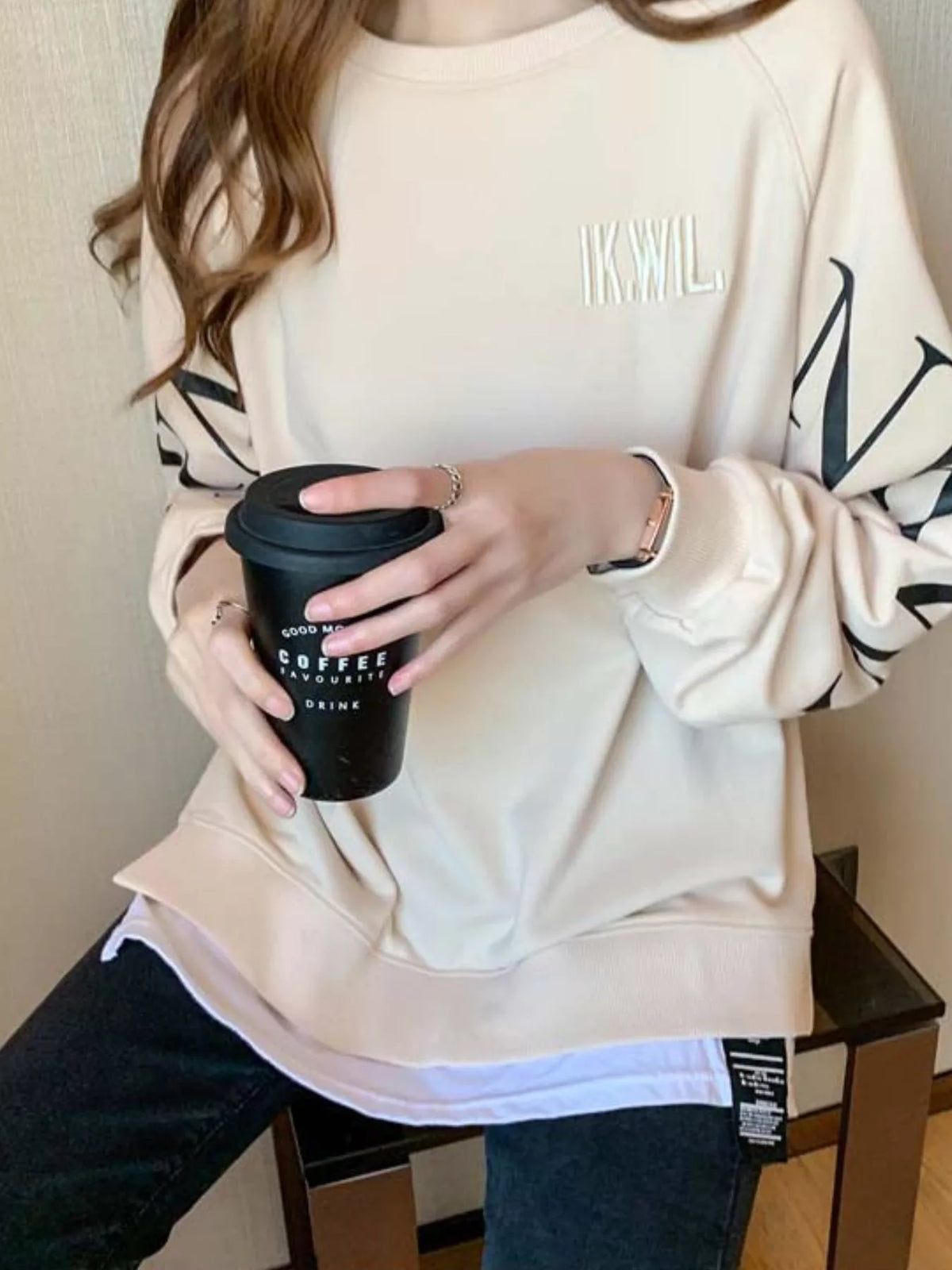 Apricot layered-hem sweatshirt with graphic sleeve detail