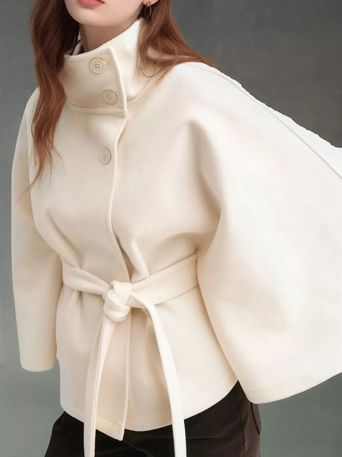 White belted button-front cape — front view