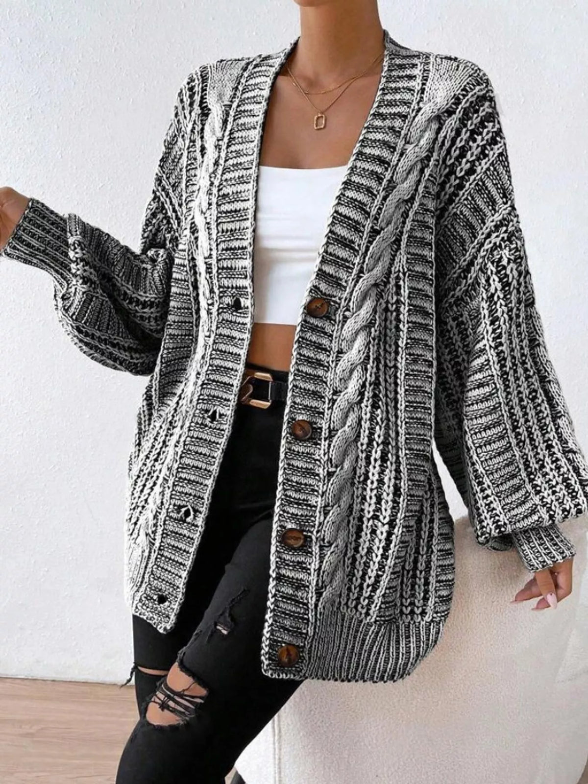 Gray chunky cable knit button down cardigan, front view