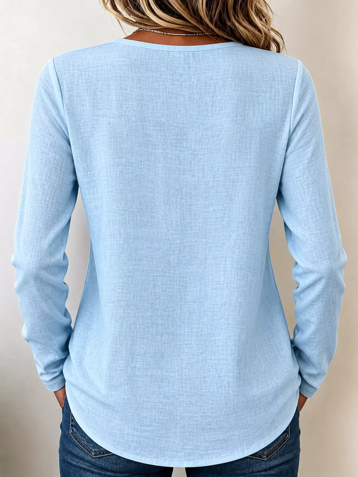 Light Blue long sleeve decorative button blouse, back view