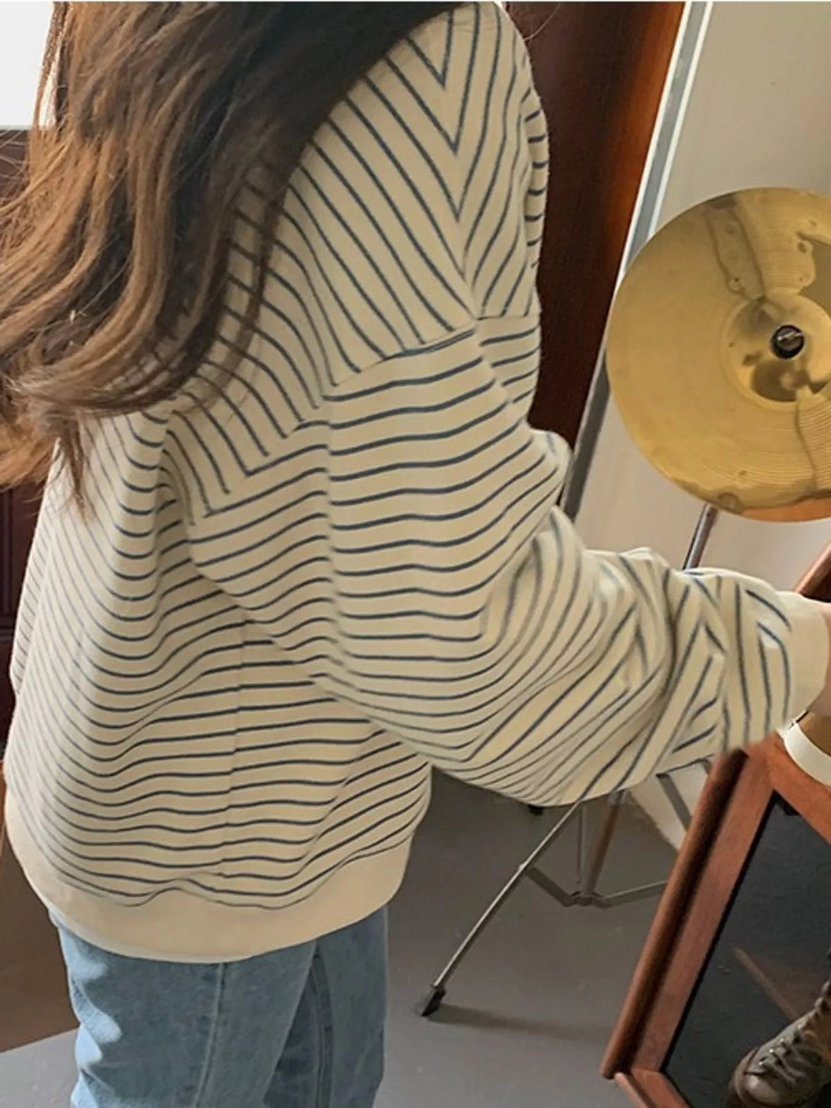 Cream and blue striped long sleeve crewneck t shirt, side view