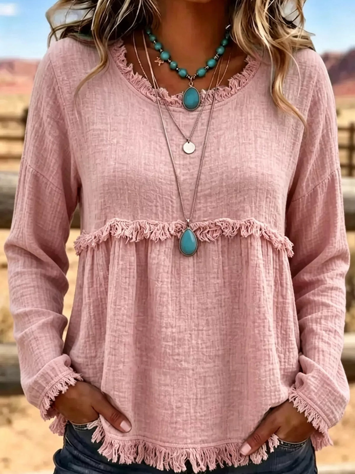 Pink frayed hem textured blouse, front view