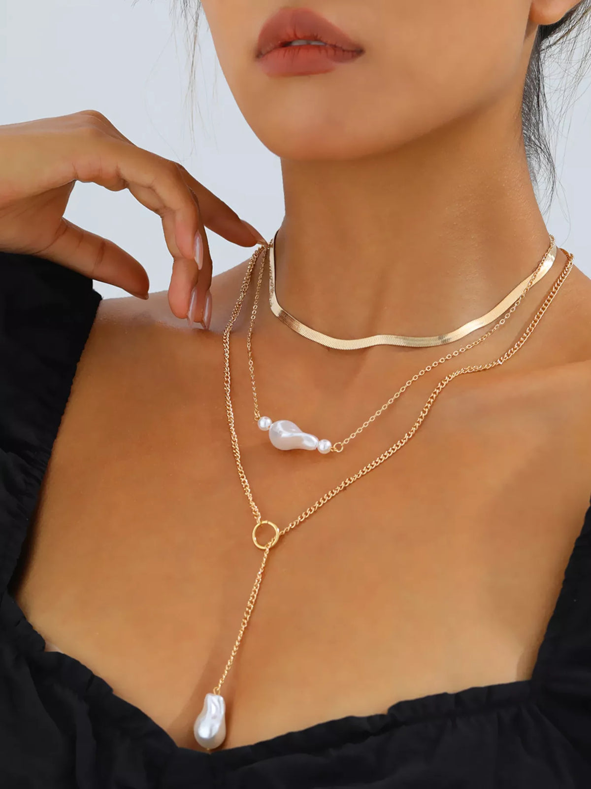 Gold three-layer pearl necklace