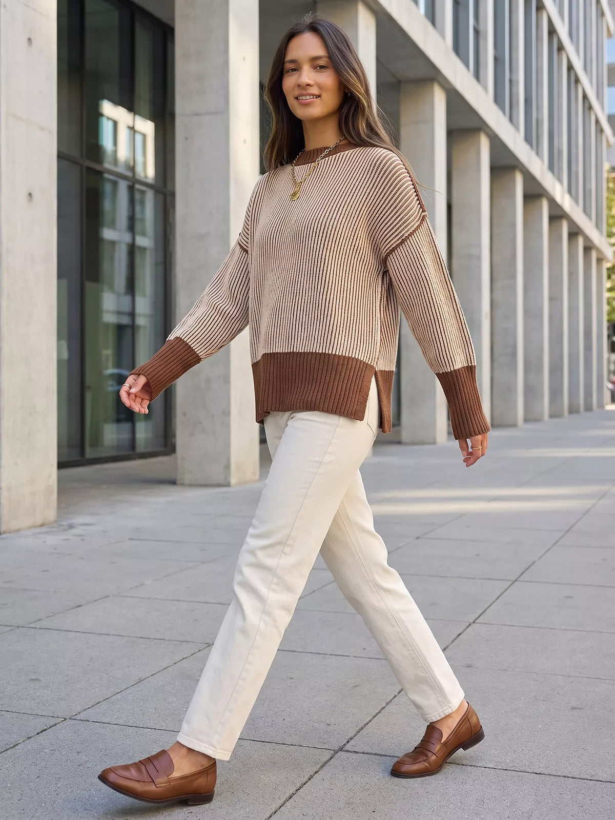 Beige and brown ribbed side-slit sweater with contrast trim, full-length styled view.