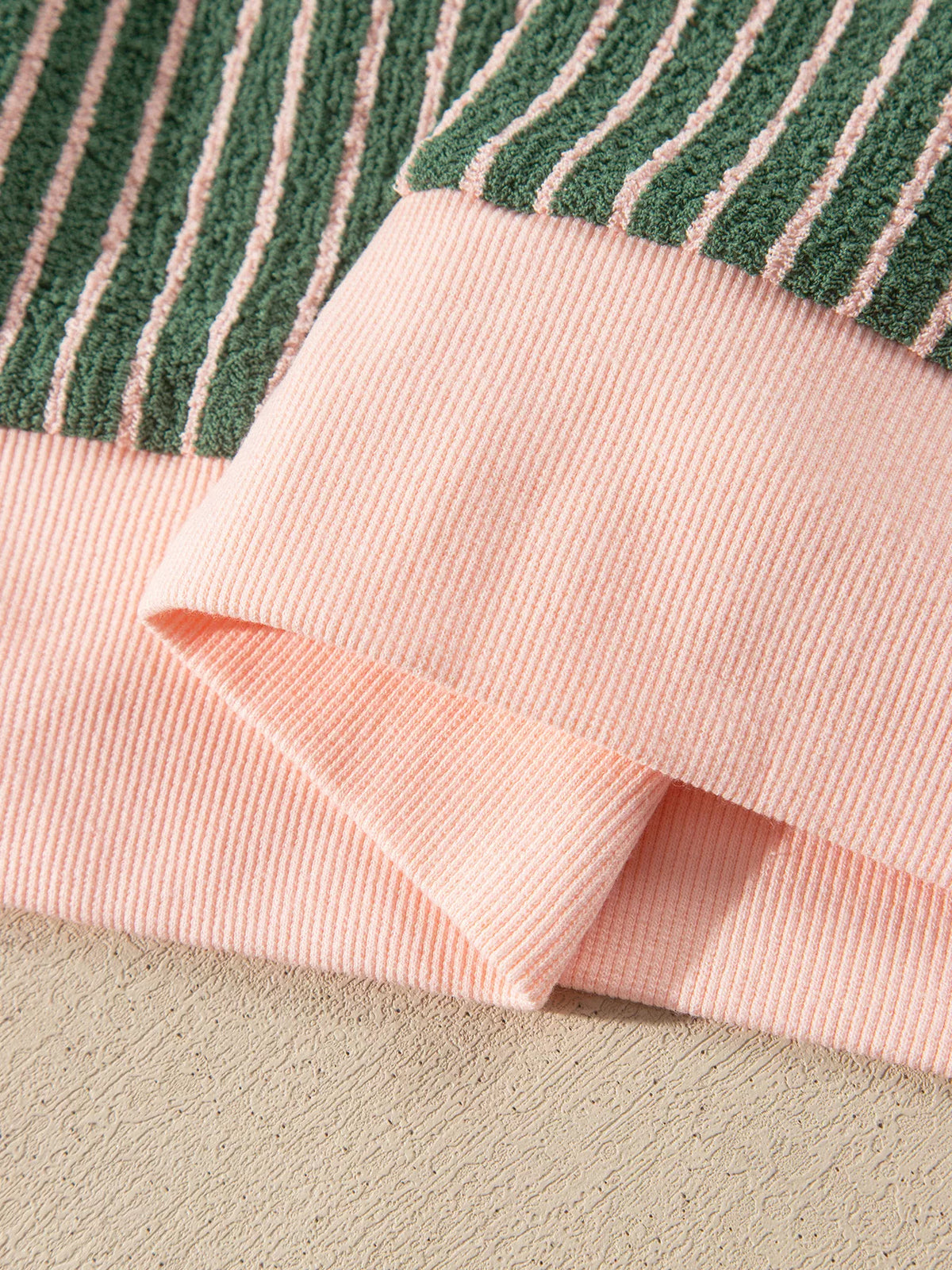 Pink ribbed hem on green and pink striped striped round neck patchwork cardigan