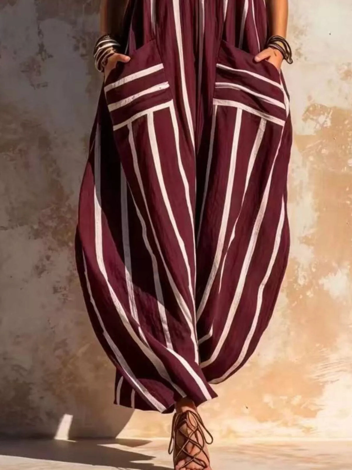 Burgundy and white striped sleeveless jumpsuit, pocket and leg detail