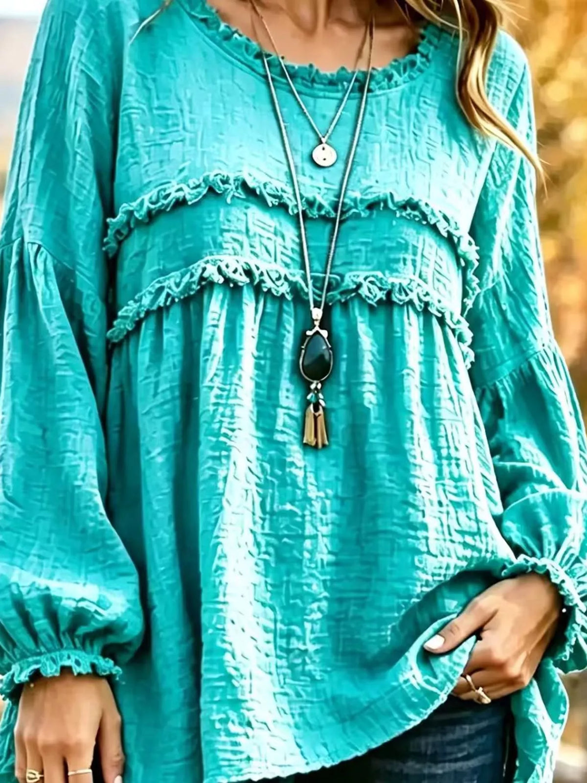 Turquoise textured frayed-trim peplum blouse
