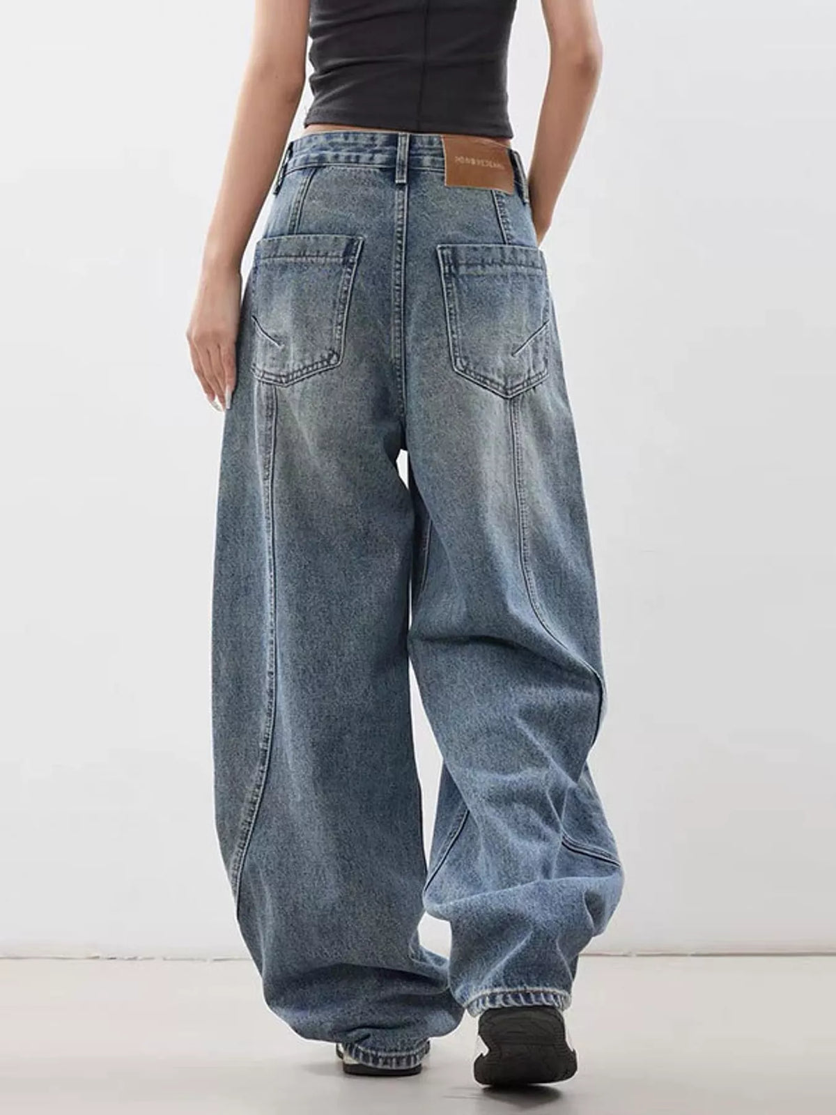 Blue wide leg baggy jeans, back view