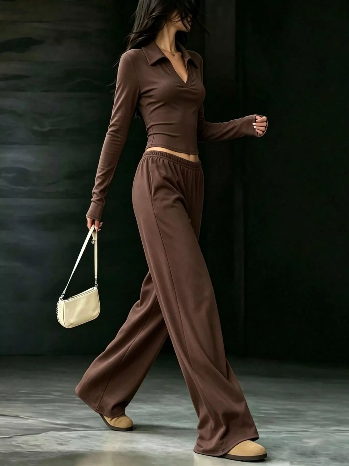 Brown collared crop top and wide-leg pants set, side walking view