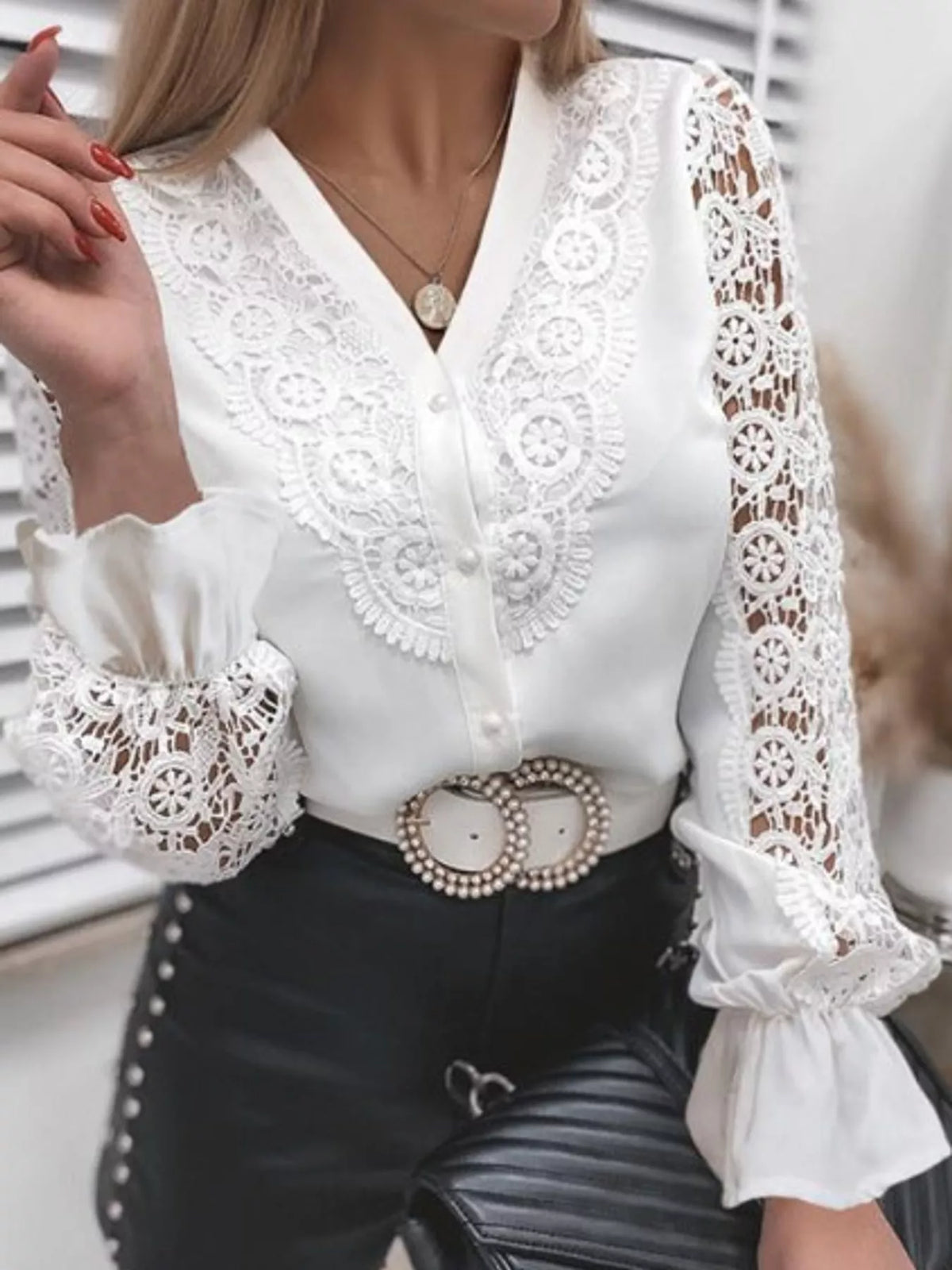 White shirt with openwork sleeves and flounce cuffs