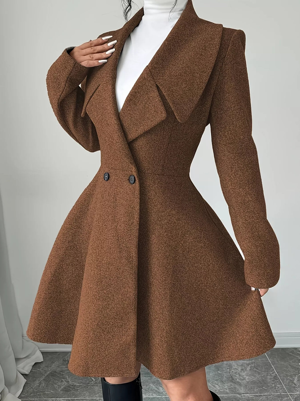 Brown double-breasted flared coat, lapel and waist detail