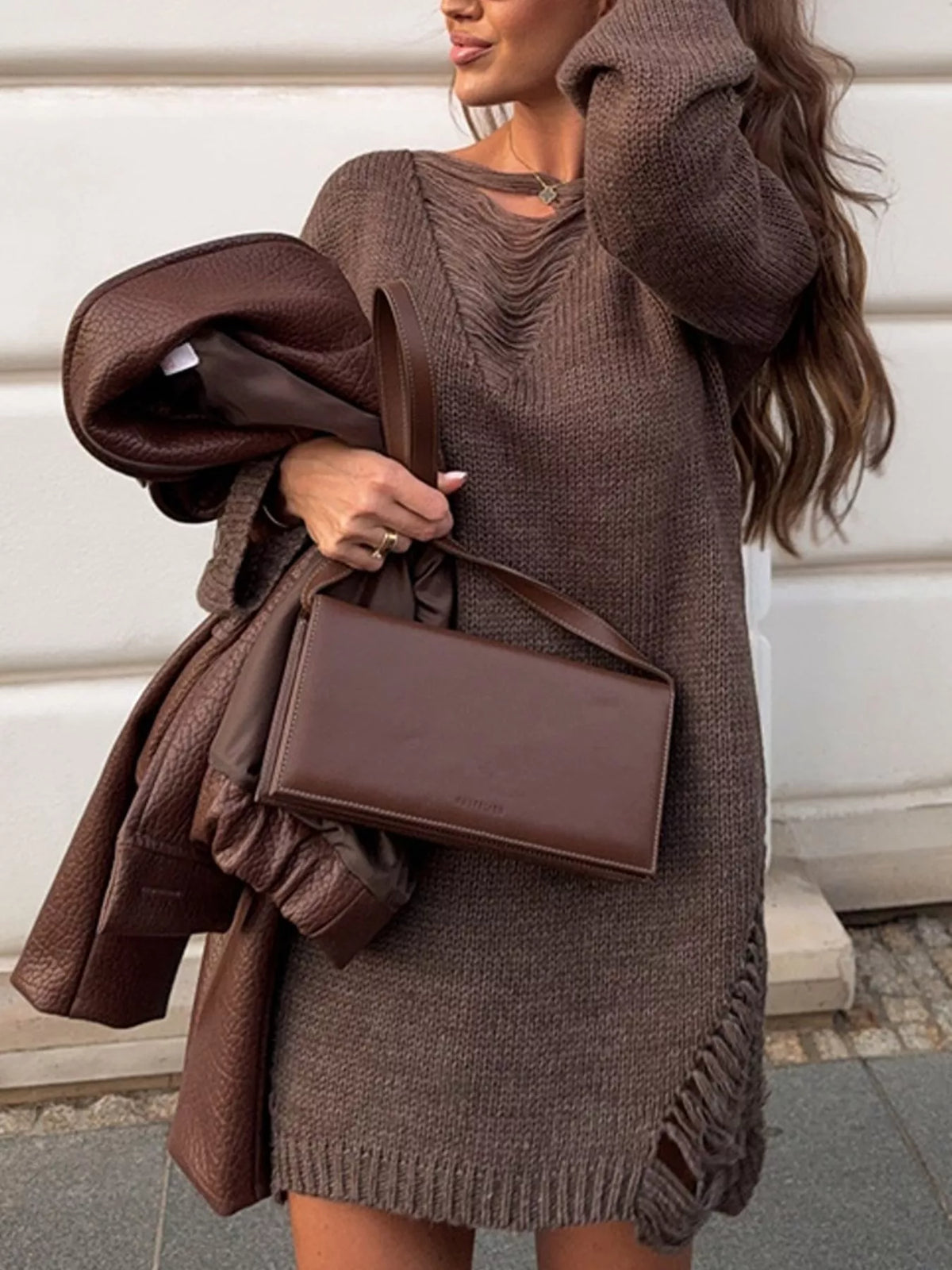 Brown distressed sweater dress, front view with bag