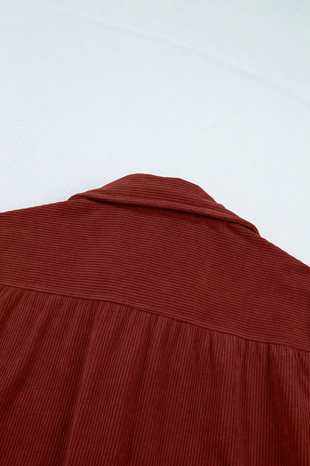 Rust corduroy button-down shirt, back yoke detail