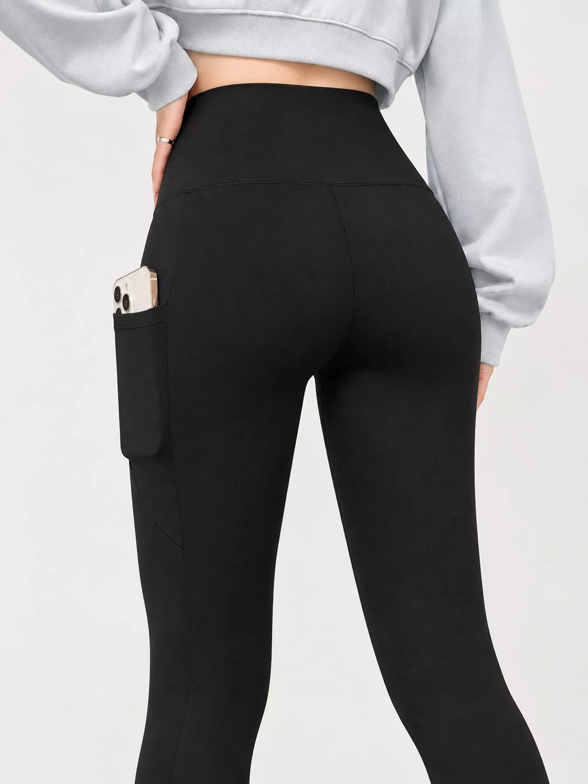 Women's High-Waisted Active Leggings with Side Pockets in black — back view