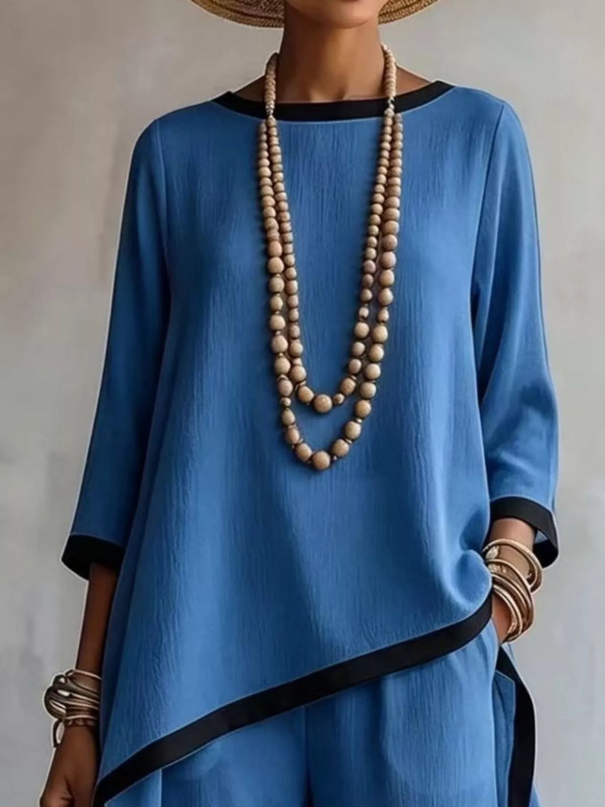 Blue contrast-trim top and pants set, asymmetric top detail