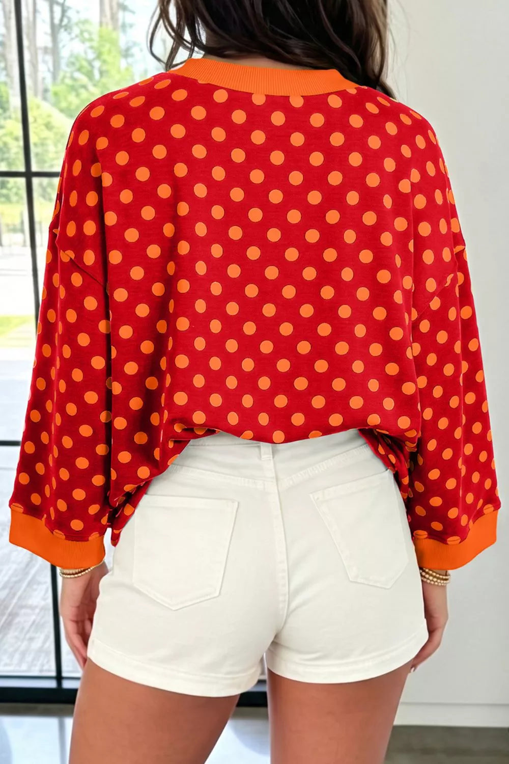 Polka Dot Sweatshirt in red with orange dots, back view