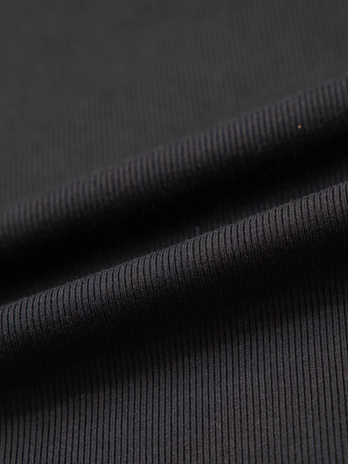 Ribbed fabric on black round neck frill detail long sleeve top