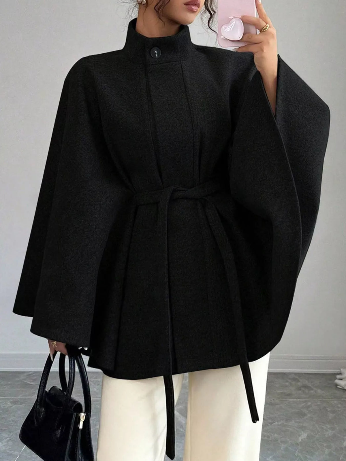 Black tie-waist cape — front view
