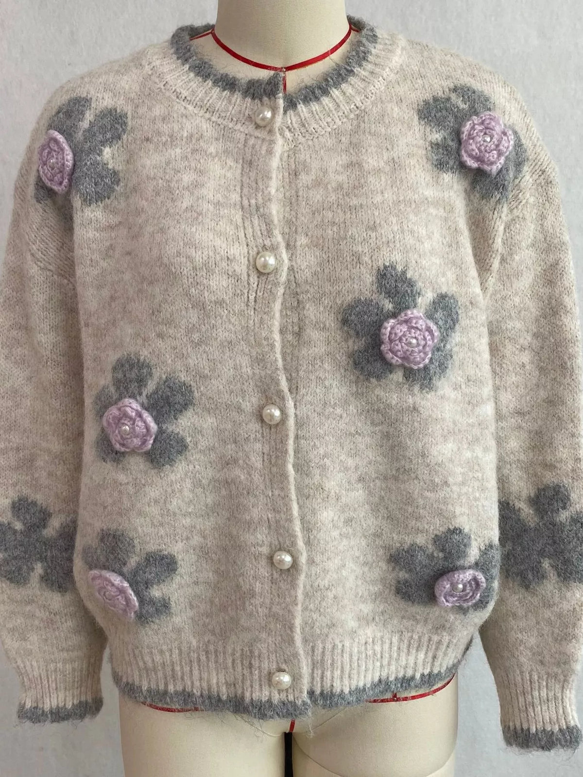 Floral-applique knit cardigan in beige, mannequin front view