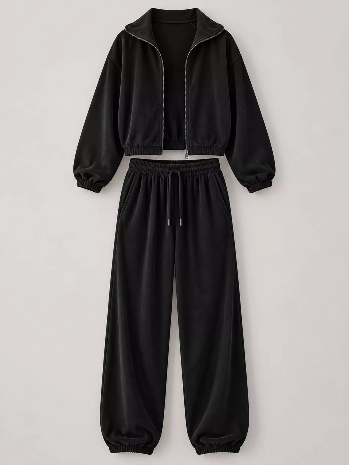 Black zip-up outerwear and pants set — front view
