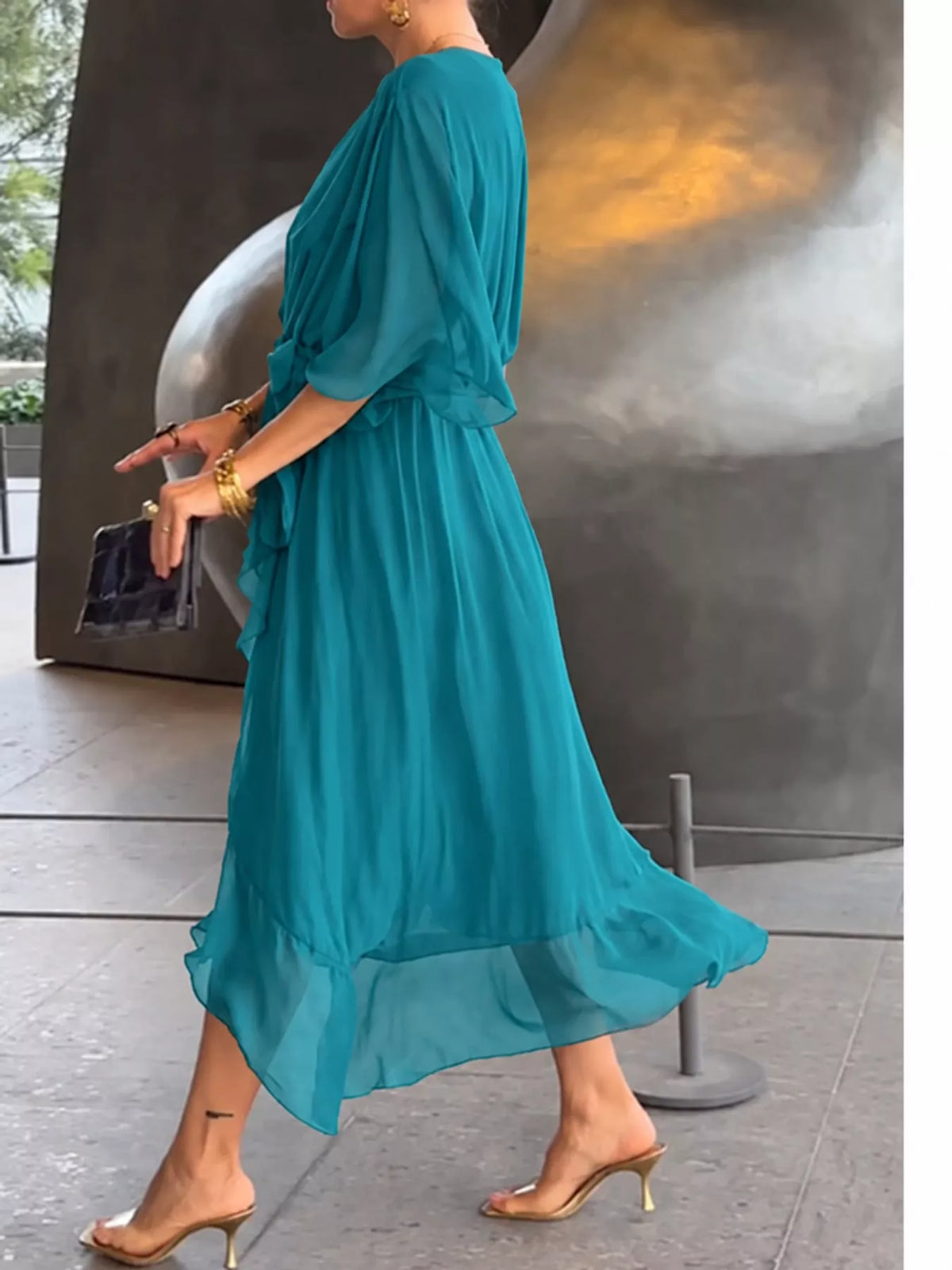 Teal batwing sleeve wrap dress with waist tie, side view