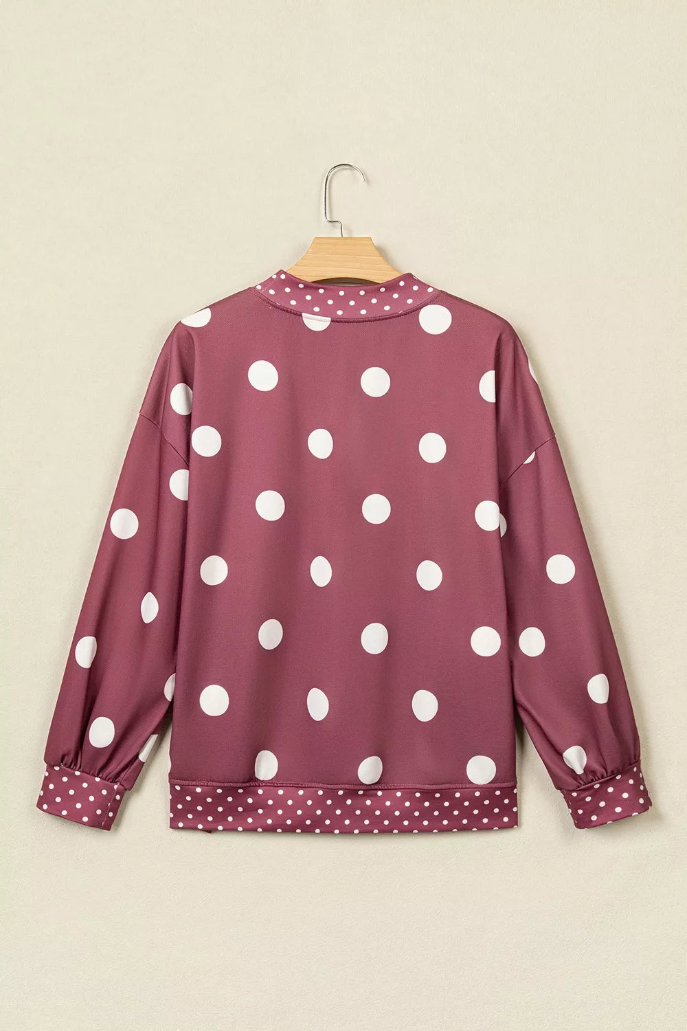 Burgundy polka dot tunic sweatshirt, back on hanger
