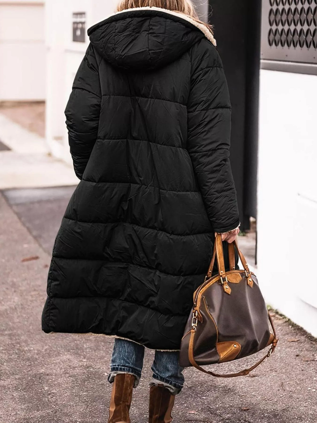 Black longline sherpa-lined hooded puffer coat, back view