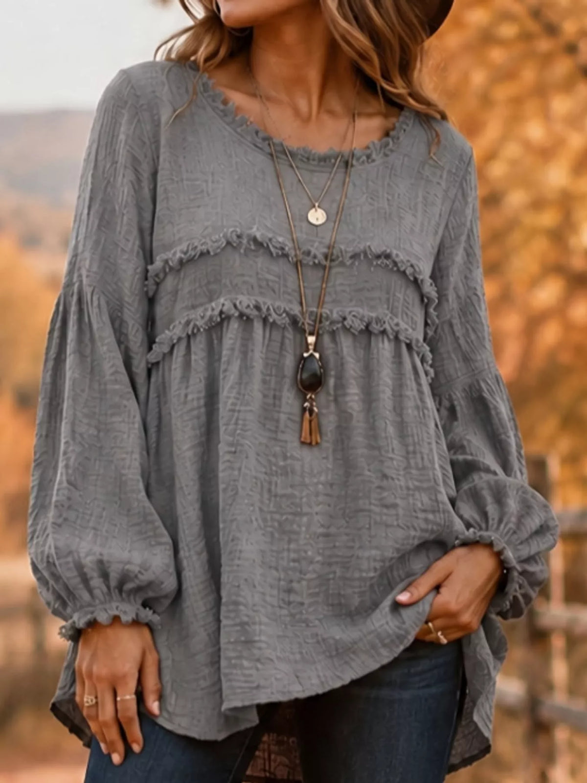 Gray textured frayed-trim peplum blouse