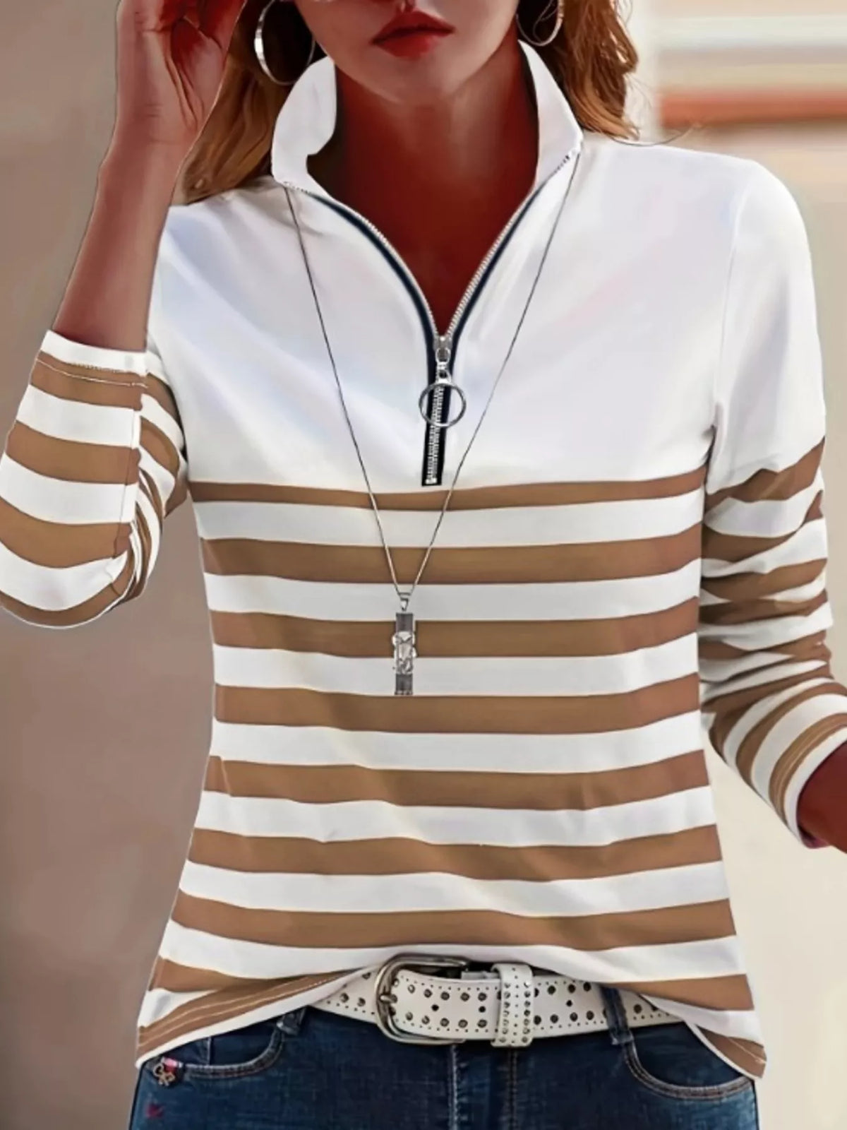 Brown and white quarter-zip striped top, front view