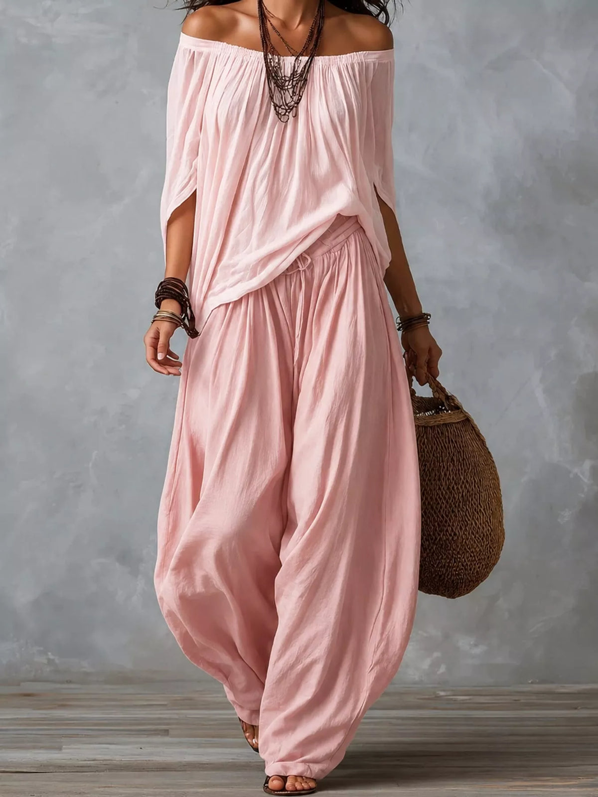Pink off-shoulder top and wide-leg harem pants set — front view