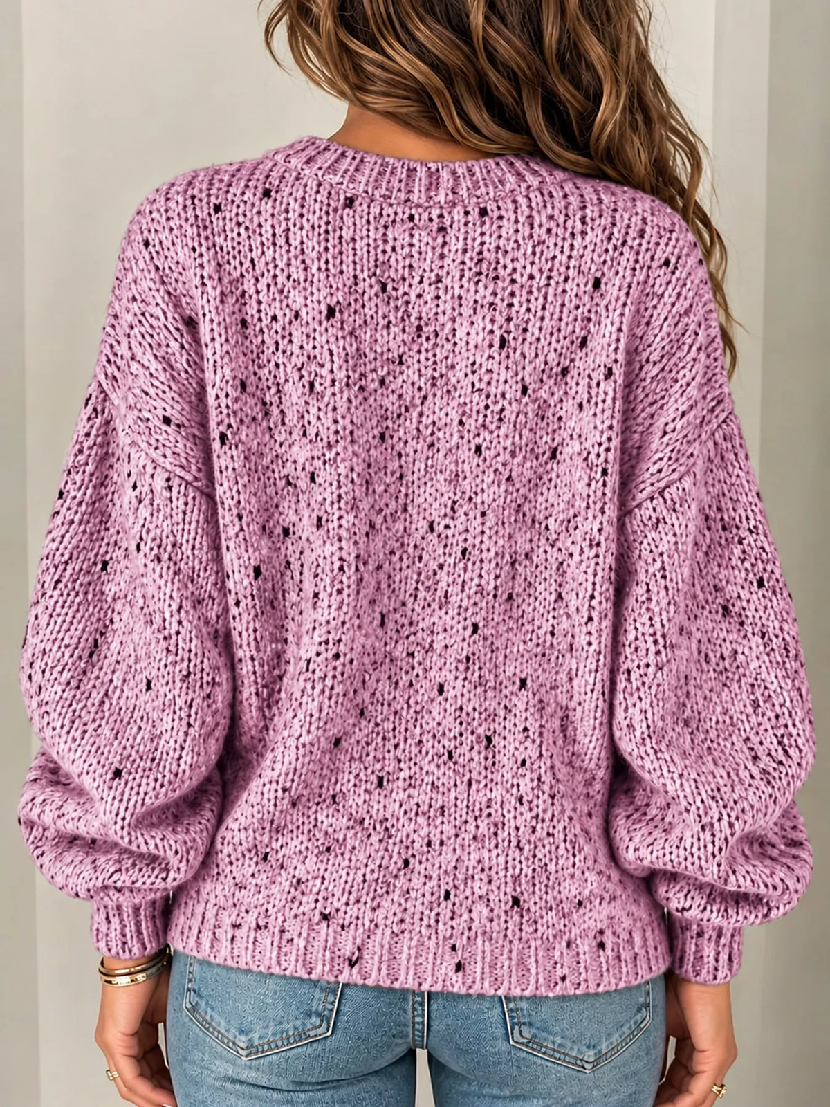 Pink chunky knit round neck sweater, back view