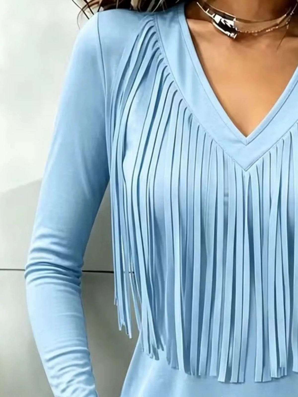 Light blue fringe V-neck top, neckline and fringe close-up