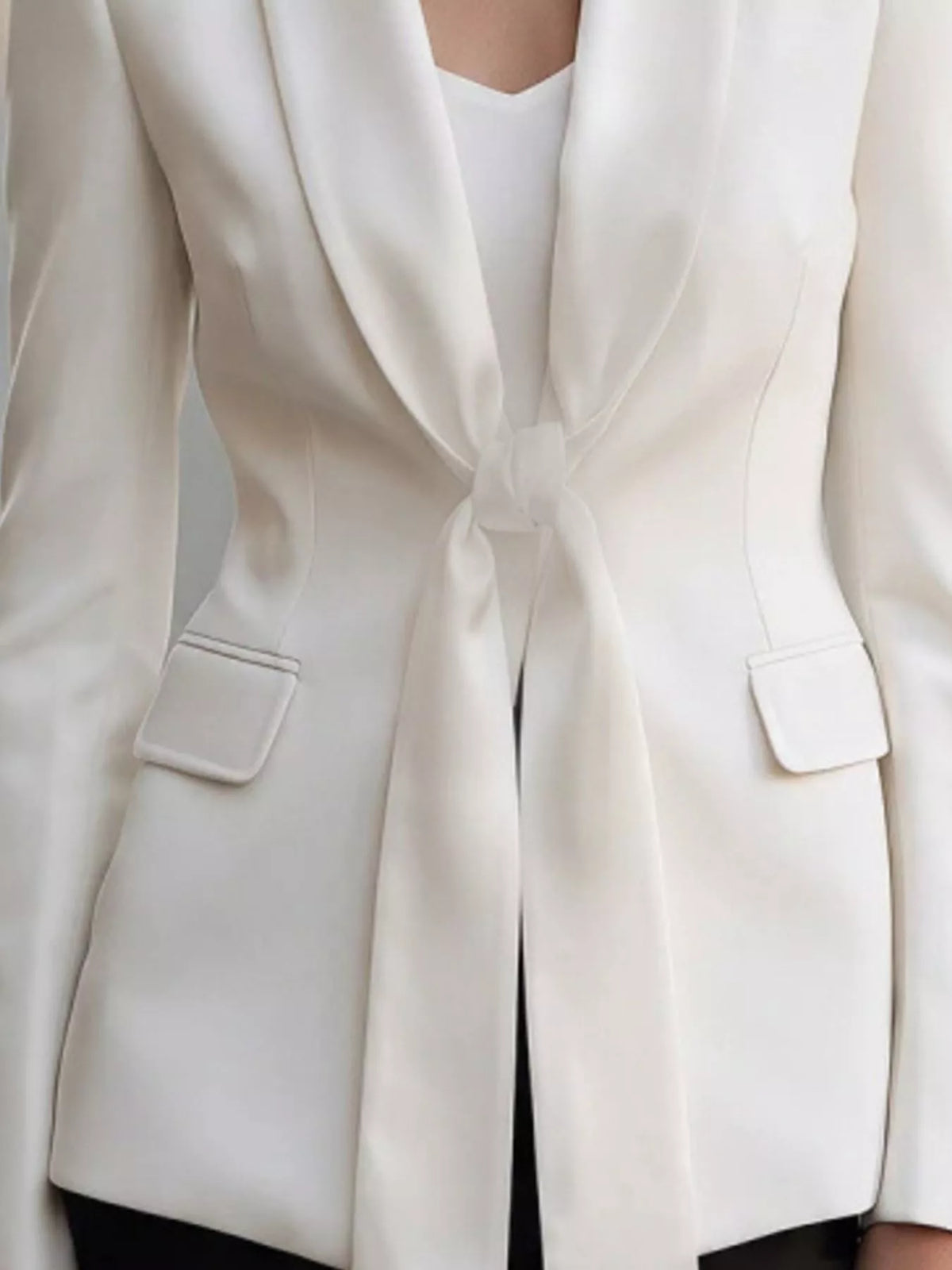 Tie-front lapel collar blazer in white, front tie and pocket detail