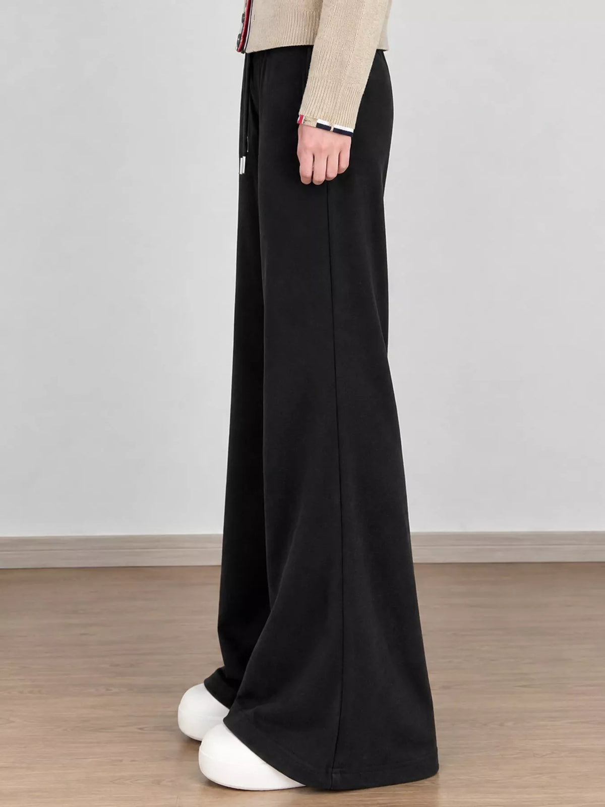 Black drawstring pants, side view