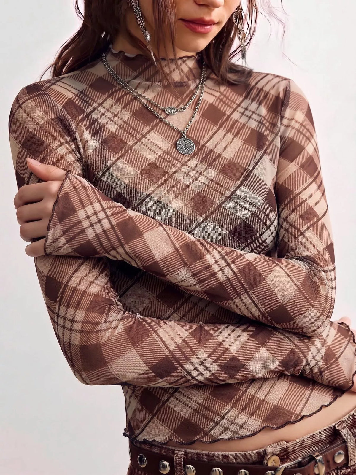 Brown sheer plaid mock-neck top, sleeve and front detail