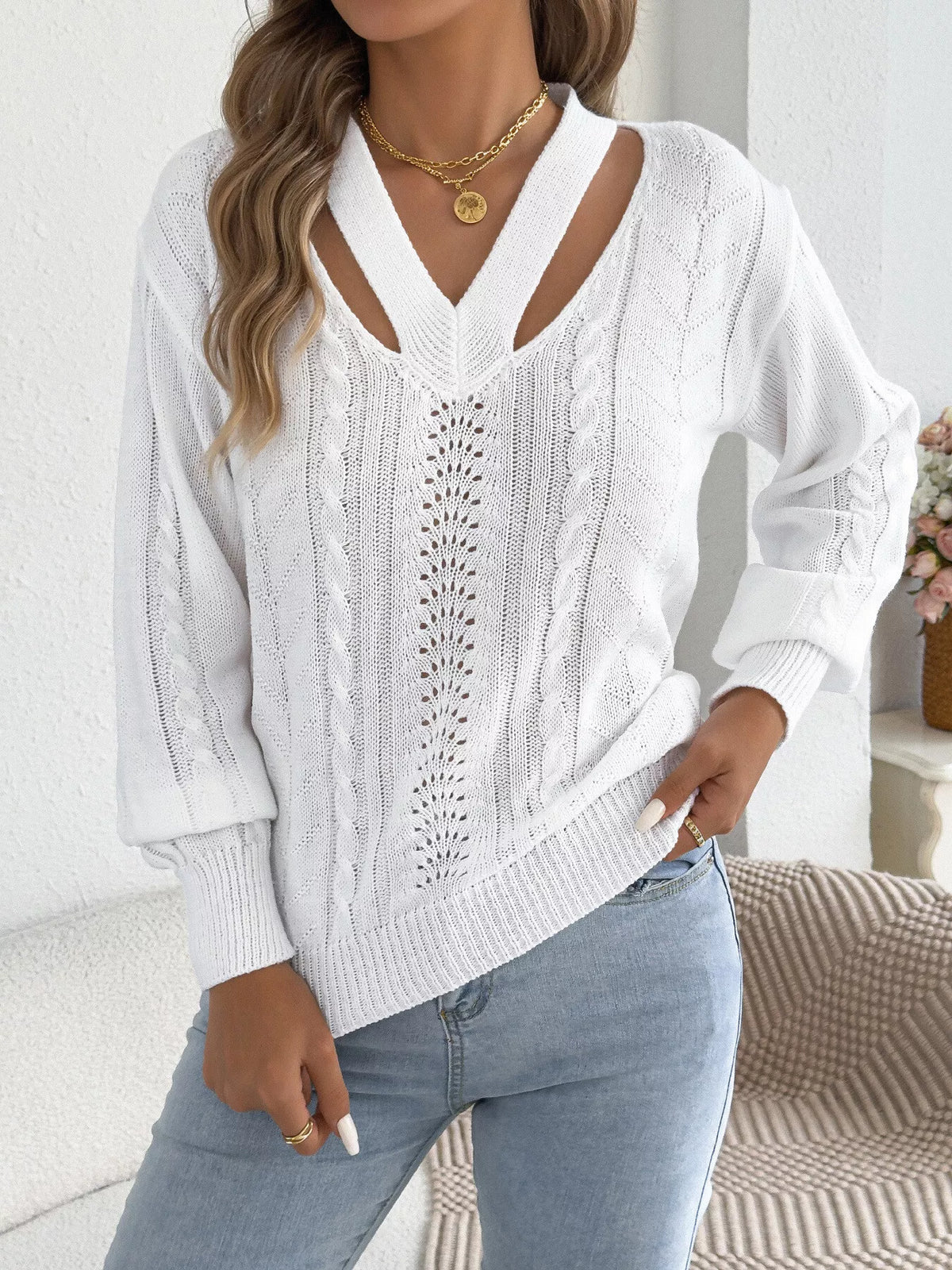 White cut-out cable knit sweater